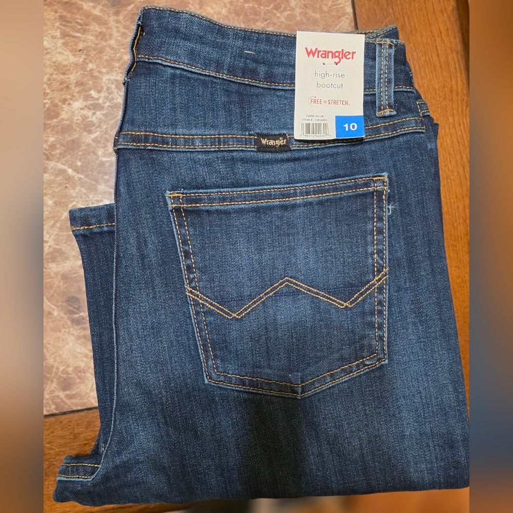 Wrangler Women's High-Rise Bootcut Stretch Jeans in a dark blue wash.
